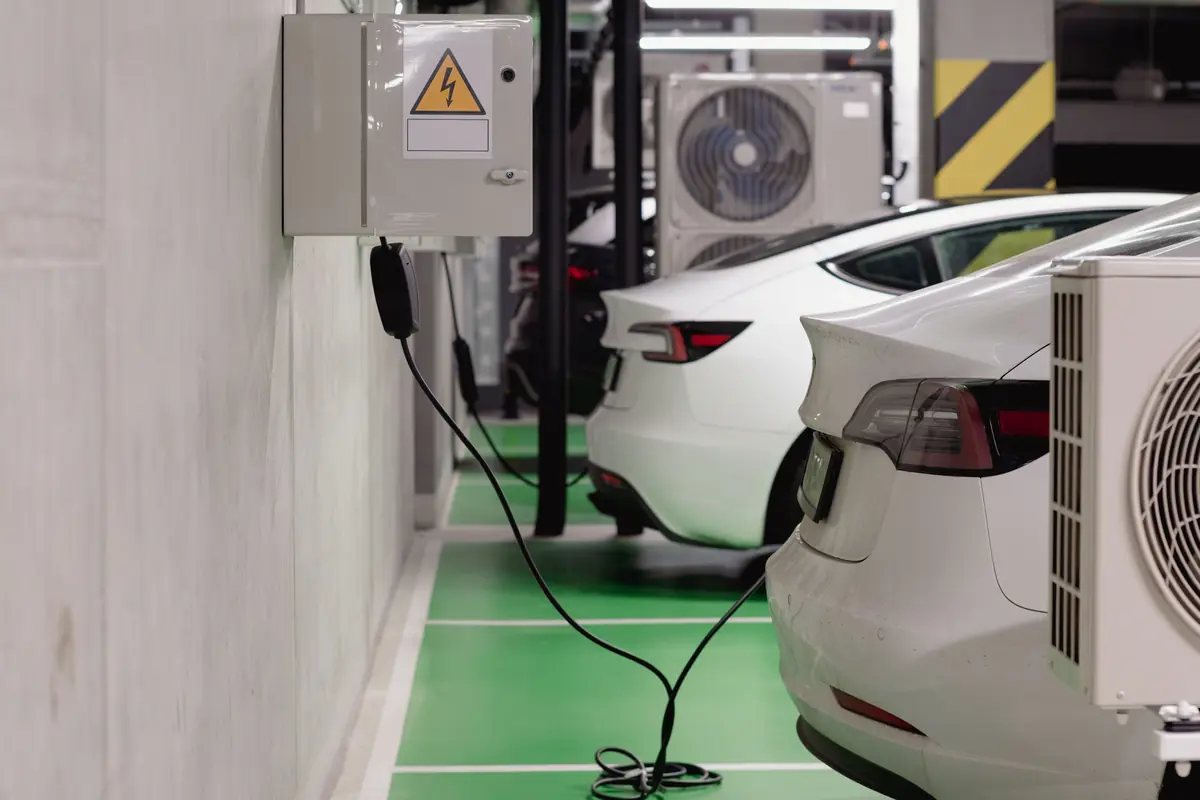 Cars charging in a shared garage