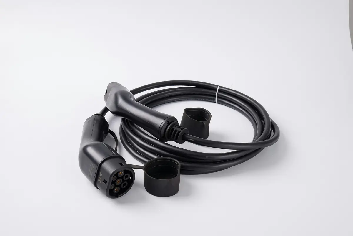 A charging cable and its connectors on a white surface