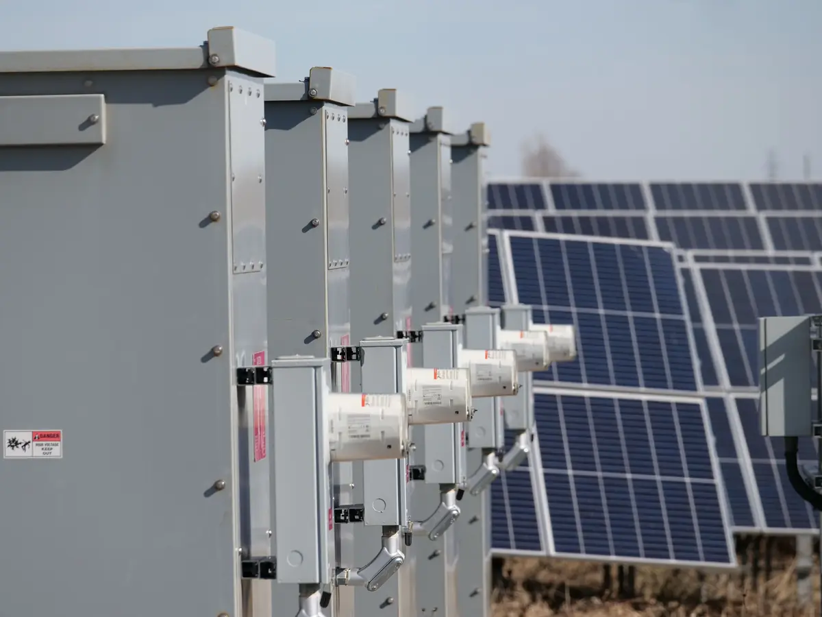Electrical cabinets beside a solar array